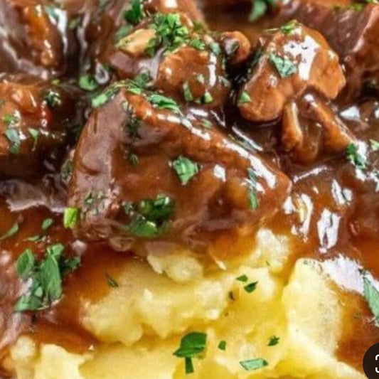 Steak Tips in Red Wine Thyme Sauce over Buttered Mashed Potatoes